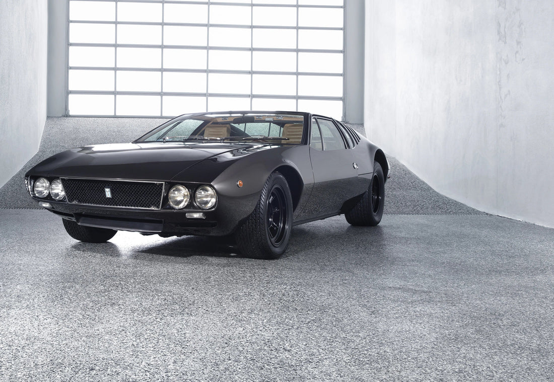 De Tomaso Mangusta photographed front three-quarter in a pale concrete studio.