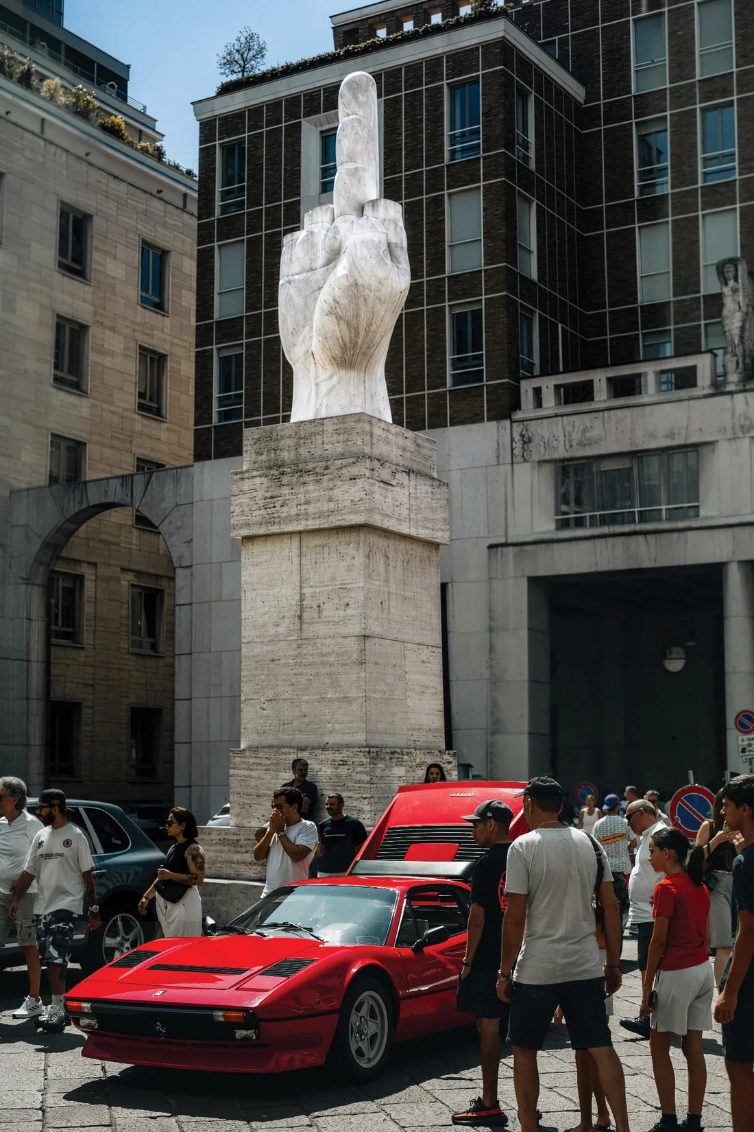 Ferrari F40 at Piazza Affari in Milan with the L.O.V.E. sculpture and Sunday gathering.